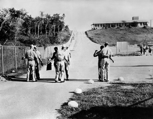 
CUBA, Guantanamo Bay : Admiral Robert Dennison (L), US navy commander of the Atlantic forces and Lieutenant General Louis W. Truman, commander of the Joint Task Force-Four (R) are seen during a visit to the American naval base of Guantanamo Bay in Cuba, 17 November 1962. The US military naval base of Guantanamo is in stand by and was reinforced because of the Cuban missile crisis. The Cuban missile crisis and its aftermath was the most serious U.S.-Soviet confrontation of the Cold War.
