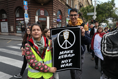 Protester holding a sign reading 