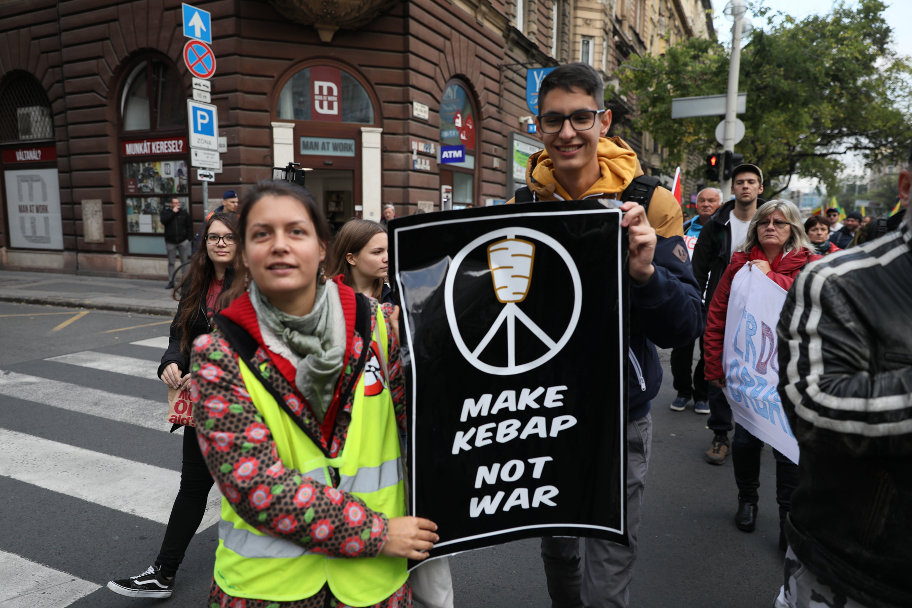 Protester holding a sign reading 