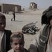 Marjah, Helmand tartomány, Dél-Afganisztán. Az amerikai hadsereg afgán gyerekeket alkalmaz a település helyreállítási és köztisztasági munkáihoz


