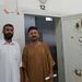 Abdul Basszet és Abdul Hakim volt cellájuk előtt
