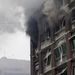 Füst száll fel a felrobbantott oszlói kormányzati épületből a 2011 júliusi merénylet után