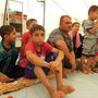 Keresztény menekültek Erbilben a káld katolikus egyház által fenntartott menekülttáborban.
