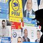 Választási kampányplakátok előtt megy el egy idős férfi Bukarestben