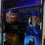 Egy orvos ül egy mentőautóban a Crocus City Hall közelében 2024. március 22-én 