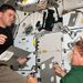 2011. július 13. A küldetés 6. napja. Rex Walheim és Sandra Magnus az Atlantis középső fedélzetén megbeszélik a rakomány átszállításának fontos részleteit.